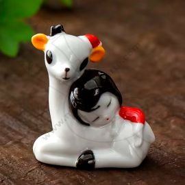 POSA PINCEL DE PORCELANA VENADO CON NIÑA